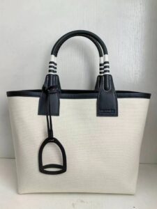 Steeple 25 Bag. Authentic quality luxury bag crafted in genuine leather comes with authenticity card, dust bag and gift bag. Where art meets heritage. The *rmès Steeple Bag is a charming fusion of heritage and artistry, crafted from a blend of canvas and Swift leather. Its design pays tribute to *rmès’ equestrian roots with whip-shaped handles and a stirrup-inspired charm, adding a playful yet sophisticated touch. Lightweight yet spacious, the Steeple is ideal for daily use. Whether you opt for a vibrant motif or a sleek, single-color design, this bag stands out as an artistic expression of luxury that seamlessly integrates into a modern lifestyle. Praised for its unique aesthetic and accessibility within the *rmès lineup, the Steeple Bag is adored by fashion enthusiasts who appreciate its colorful palette and bold personality. While it’s best suited for those who enjoy the texture and look of canvas, it remains a versatile statement piece that captures the spirit of everyday elegance. | PURSE POP UP LIVE Steeple 25 Bag. Authentic quality luxury bag crafted in genuine leather comes with authenticity card, dust bag and gift bag. Where art meets heritage. The *rmès Steeple Bag is a charming fusion of heritage and artistry, crafted from a blend of canvas and Swift leather. Its design pays tribute to *rmès’ equestrian roots with whip-shaped handles and a stirrup-inspired charm, adding a playful yet sophisticated touch. Lightweight yet spacious, the Steeple is ideal for daily use. Whether you opt for a vibrant motif or a sleek, single-color design, this bag stands out as an artistic expression of luxury that seamlessly integrates into a modern lifestyle. Praised for its unique aesthetic and accessibility within the *rmès lineup, the Steeple Bag is adored by fashion enthusiasts who appreciate its colorful palette and bold personality. While it’s best suited for those who enjoy the texture and look of canvas, it remains a versatile statement piece that captures the spirit of everyday elegance.