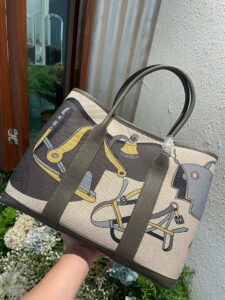 Garden Party Voyage. Authentic quality luxury bag crafted in genuine leather comes with authenticity card, dust bag and gift bag. The Art of Everyday Escape. Chic, structured, and effortlessly refined, the *RMÈS Garden Party Voyage is the perfect companion for your daily adventures or spontaneous weekend getaways. Crafted with precision in supple Negonda leather or canvas with leather trim, this midsize tote strikes the perfect balance between luxury and functionality. Its minimalist silhouette is elevated by discreet Clou de Selle snap closures and expandable sides, offering both form and flexibility. Spacious enough for your essentials yet compact enough to carry with ease, it’s a timeless piece designed to move with you—gracefully. Whether carried in hand or worn over the shoulder, the Garden Party Voyage 36 speaks in whispers of elegance and unmistakable *RMÈS craftsmanship. Every day is a journey. Travel beautifully. | PURSE POP UP LIVE Garden Party Voyage. Authentic quality luxury bag crafted in genuine leather comes with authenticity card, dust bag and gift bag. The Art of Everyday Escape. Chic, structured, and effortlessly refined, the *RMÈS Garden Party Voyage is the perfect companion for your daily adventures or spontaneous weekend getaways. Crafted with precision in supple Negonda leather or canvas with leather trim, this midsize tote strikes the perfect balance between luxury and functionality. Its minimalist silhouette is elevated by discreet Clou de Selle snap closures and expandable sides, offering both form and flexibility. Spacious enough for your essentials yet compact enough to carry with ease, it’s a timeless piece designed to move with you—gracefully. Whether carried in hand or worn over the shoulder, the Garden Party Voyage 36 speaks in whispers of elegance and unmistakable *RMÈS craftsmanship. Every day is a journey. Travel beautifully.
