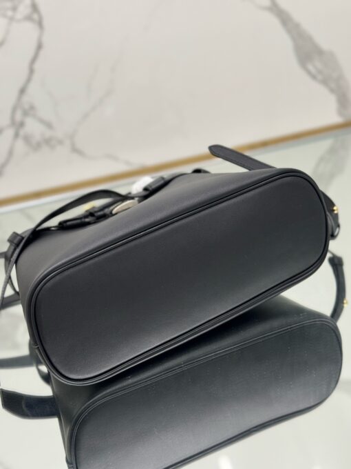 Buckle Small Leather Handbag. Authentic quality luxury bag crafted in genuine leather comes with authenticity card, dust bag and gift bag. Sophistication Meets Utility. Sleek, structured, and undeniably Pr*da — the Buckle Small Leather Handbag captures the brand’s signature balance of minimalist elegance and refined detail. Crafted in smooth leather with a buttery-soft nappa interior, this compact piece is a masterclass in functional luxury. A standout feature? Its interchangeable belt strap, adding a bold, modern twist to the timeless silhouette. Whether you're heading to a meeting or a soirée, this bag adapts seamlessly to your mood and moment. Finished with the embossed iconic logo, it’s a quiet statement of taste and distinction. A versatile companion for the woman who appreciates precision, polish, and just the right touch of edge.