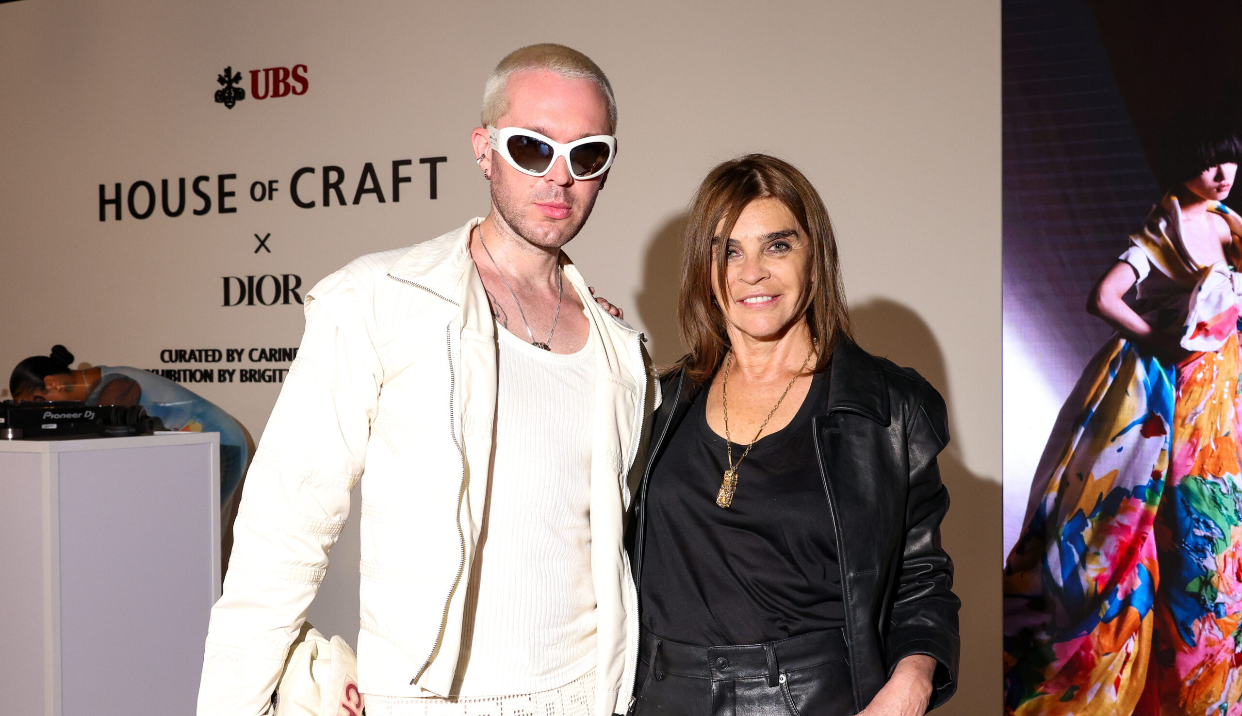 Carine Roitfeld posing at the Dior exhibition in New York sponsored by UBS