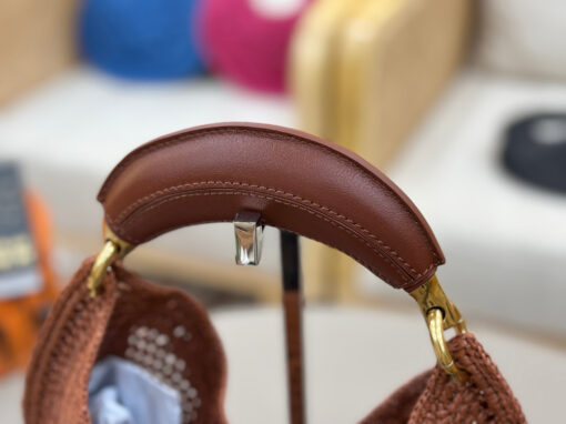 Summer Banana Hobo. Authentic quality luxury bag crafted in genuine leather comes with authenticity card, dust bag and gift bag. Artisanal Spirit, Curved in Style. Say hello to sunshine in bag form. The *LOÉ Summer Banana Hobo Bag is a joyful blend of craftsmanship and creativity, handwoven over four days by a single artisan in collaboration with Made For A Woman. This is not just a bag—it’s a story stitched in raffia and trimmed in luxurious calfskin. Its curved, banana-inspired silhouette hugs the shoulder with ease, while the sculptural handle and handwritten signature nod to *loé’s heritage of effortless elegance. Light, natural, and undeniably chic, it's the perfect companion for sun-soaked escapes or city strolls with a coastal state of mind. A celebration of craftsmanship, femininity, and the art of slow fashion.