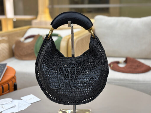 Summer Banana Hobo. Authentic quality luxury bag crafted in genuine leather comes with authenticity card, dust bag and gift bag. Artisanal Spirit, Curved in Style. Say hello to sunshine in bag form. The *LOÉ Summer Banana Hobo Bag is a joyful blend of craftsmanship and creativity, handwoven over four days by a single artisan in collaboration with Made For A Woman. This is not just a bag—it’s a story stitched in raffia and trimmed in luxurious calfskin. Its curved, banana-inspired silhouette hugs the shoulder with ease, while the sculptural handle and handwritten signature nod to *loé’s heritage of effortless elegance. Light, natural, and undeniably chic, it's the perfect companion for sun-soaked escapes or city strolls with a coastal state of mind. A celebration of craftsmanship, femininity, and the art of slow fashion.