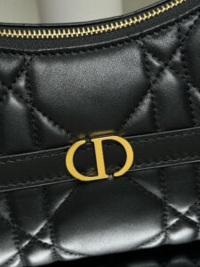 Cigale Mini Bag. Authentic quality luxury bag crafted in genuine leather comes with authenticity card, dust bag and gift bag. A Contemporary Classic in the Making. Meet the latest gem in the Miss Caro line: the *ior Cigale Mini Bag—a sleek, structured piece that blends timeless elegance with modern attitude. Crafted in supple lambskin and elevated by bold Macrocannage topstitching, this petite powerhouse exudes refined femininity from every angle. The standout tonal strap, adorned with an antique gold-finish CD signature, adds a sculptural touch to its streamlined silhouette. A secure zip compartment keeps your essentials close, while the adjustable leather strap offers effortless over-the-shoulder chic. Lightweight, luxurious, and unmistakably *ior—this is the mini bag that delivers big on style. Miss Caro’s modern muse has arrived. | PURSE POP UP LIVE Cigale Mini Bag. Authentic quality luxury bag crafted in genuine leather comes with authenticity card, dust bag and gift bag. A Contemporary Classic in the Making. Meet the latest gem in the Miss Caro line: the *ior Cigale Mini Bag—a sleek, structured piece that blends timeless elegance with modern attitude. Crafted in supple lambskin and elevated by bold Macrocannage topstitching, this petite powerhouse exudes refined femininity from every angle. The standout tonal strap, adorned with an antique gold-finish CD signature, adds a sculptural touch to its streamlined silhouette. A secure zip compartment keeps your essentials close, while the adjustable leather strap offers effortless over-the-shoulder chic. Lightweight, luxurious, and unmistakably *ior—this is the mini bag that delivers big on style. Miss Caro’s modern muse has arrived.
