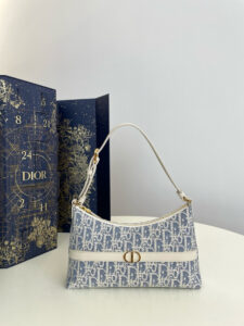 Cigale Mini Bag. Authentic quality luxury bag crafted in genuine leather comes with authenticity card, dust bag and gift bag. A Contemporary Classic in the Making. Meet the latest gem in the Miss Caro line: the *ior Cigale Mini Bag—a sleek, structured piece that blends timeless elegance with modern attitude. Crafted in supple lambskin and elevated by bold Macrocannage topstitching, this petite powerhouse exudes refined femininity from every angle. The standout tonal strap, adorned with an antique gold-finish CD signature, adds a sculptural touch to its streamlined silhouette. A secure zip compartment keeps your essentials close, while the adjustable leather strap offers effortless over-the-shoulder chic. Lightweight, luxurious, and unmistakably *ior—this is the mini bag that delivers big on style. Miss Caro’s modern muse has arrived.