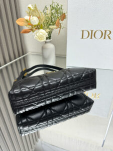 Cigale Mini Bag. Authentic quality luxury bag crafted in genuine leather comes with authenticity card, dust bag and gift bag. A Contemporary Classic in the Making. Meet the latest gem in the Miss Caro line: the *ior Cigale Mini Bag—a sleek, structured piece that blends timeless elegance with modern attitude. Crafted in supple lambskin and elevated by bold Macrocannage topstitching, this petite powerhouse exudes refined femininity from every angle. The standout tonal strap, adorned with an antique gold-finish CD signature, adds a sculptural touch to its streamlined silhouette. A secure zip compartment keeps your essentials close, while the adjustable leather strap offers effortless over-the-shoulder chic. Lightweight, luxurious, and unmistakably *ior—this is the mini bag that delivers big on style. Miss Caro’s modern muse has arrived. | PURSE POP UP LIVE Cigale Mini Bag. Authentic quality luxury bag crafted in genuine leather comes with authenticity card, dust bag and gift bag. A Contemporary Classic in the Making. Meet the latest gem in the Miss Caro line: the *ior Cigale Mini Bag—a sleek, structured piece that blends timeless elegance with modern attitude. Crafted in supple lambskin and elevated by bold Macrocannage topstitching, this petite powerhouse exudes refined femininity from every angle. The standout tonal strap, adorned with an antique gold-finish CD signature, adds a sculptural touch to its streamlined silhouette. A secure zip compartment keeps your essentials close, while the adjustable leather strap offers effortless over-the-shoulder chic. Lightweight, luxurious, and unmistakably *ior—this is the mini bag that delivers big on style. Miss Caro’s modern muse has arrived.