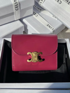 Small Flap Wallet Triomphe. Authentic quality luxury bag crafted in genuine leather comes with authenticity card, dust bag and gift bag. Small in Size, Grand in Style. Discover timeless sophistication in the palm of your hand with the *ELINE Small Flap Wallet TRIOMPHE in shiny calfskin. Meticulously crafted from luxurious leather, this compact beauty showcases the iconic Triomphe clasp in gold-tone metal, a refined nod to Parisian heritage. Despite its petite size, it opens to reveal smart compartments for cards, bills, and coins—proving that style never compromises function. Whether tucked into your favorite designer bag or carried solo for a night out, this wallet is your everyday dose of quiet luxury.