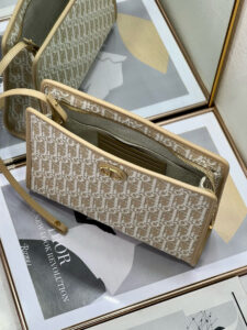 30 Montaigne Dea Pouch. Authentic quality luxury bag crafted in genuine leather comes with authenticity card, dust bag and gift bag. Effortless Elegance, Perfectly Packaged. Elevate your everyday with the 30 Montaigne Dea pouch- where timeless Dior heritage meets modern utility.Expertly crafted in iconic *ior Oblique jacquard and finished with the elegant CD signature, this pouch is more than just an accessory — it’s a statement. Its spacious interior offers room for your essentials, while the structured silhouette transitions effortlessly from clutch to organizer within your *ior Book Tote. Whether carried solo or nested in your favorite bag, the Dea pouch is your answer to understated sophistication with unmistakable style.