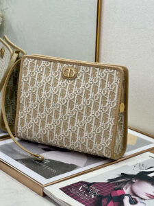 30 Montaigne Dea Pouch. Authentic quality luxury bag crafted in genuine leather comes with authenticity card, dust bag and gift bag. Effortless Elegance, Perfectly Packaged. Elevate your everyday with the 30 Montaigne Dea pouch- where timeless Dior heritage meets modern utility.Expertly crafted in iconic *ior Oblique jacquard and finished with the elegant CD signature, this pouch is more than just an accessory — it’s a statement. Its spacious interior offers room for your essentials, while the structured silhouette transitions effortlessly from clutch to organizer within your *ior Book Tote. Whether carried solo or nested in your favorite bag, the Dea pouch is your answer to understated sophistication with unmistakable style.