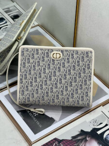 30 Montaigne Dea Pouch. Authentic quality luxury bag crafted in genuine leather comes with authenticity card, dust bag and gift bag. Effortless Elegance, Perfectly Packaged. Elevate your everyday with the 30 Montaigne Dea pouch- where timeless Dior heritage meets modern utility.Expertly crafted in iconic *ior Oblique jacquard and finished with the elegant CD signature, this pouch is more than just an accessory — it’s a statement. Its spacious interior offers room for your essentials, while the structured silhouette transitions effortlessly from clutch to organizer within your *ior Book Tote. Whether carried solo or nested in your favorite bag, the Dea pouch is your answer to understated sophistication with unmistakable style.