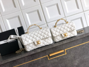 Mini Handy CC Flap Bag. Authentic quality luxury bag crafted in genuine leather comes with authenticity card, dust bag and gift bag. Small in Size, Grand in Glamour — The Essence of Elegance. Petite yet powerful, the Caviar Quilted Mini Handy CC Flap embodies timeless sophistication. Crafted from signature caviar leather with classic diamond quilting, this bag exudes refined elegance in every stitch. The design features a structured top handle and a leather-threaded chain strap, offering versatile styling from hand-carry to crossbody. Gold-plated CC details and the signature turn-lock closure add the perfect touch of luxury. Inside, a sleek leather interior with both zipper and patch pockets ensures your essentials stay beautifully organized. Compact, iconic, and unmistakably *ANEL — this is the ultimate statement in modern classic style.