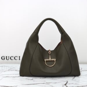 Softbit Maxi Shoulder Bag. Authentic quality luxury bag crafted in genuine leather comes with authenticity card, dust bag and gift bag. Icon Reimagined: Effortless Luxury with a Modern Bit of Bold. Gucci’s timeless heritage meets contemporary ease in the new Softbit Shoulder Bag. Crafted from supple grained leather with a luxuriously rich texture, this piece balances sophistication and function effortlessly. At its heart lies an oversized half-horsebit — a bold reinterpretation of the House’s iconic detail — accenting the magnetic closure with statement appeal. With its relaxed silhouette and refined craftsmanship, the Softbit is the perfect companion for those who favor effortless elegance with a modern edge.