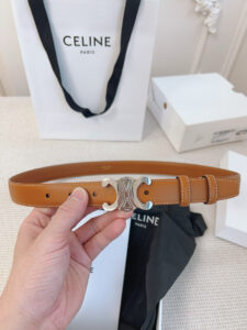 Border Triomphe Belt. Authentic quality luxury bag crafted in genuine leather comes with authenticity card, dust bag and gift bag. Where Parisian Precision Meets Effortless Elegance. The Border Triomphe Belt embodies Parisian refinement in its purest form. Crafted from luxurious smooth calfskin, this elegant accessory is framed by subtle contrasting borders that highlight its sleek lines and meticulous craftsmanship. At its center, the iconic Triomphe buckle—an emblem of *ELINE’s timeless heritage—adds a touch of golden sophistication. Whether paired with tailored trousers, a flowing dress, or high-waisted denim, this belt transforms any outfit into a statement of effortless elegance. A true symbol of quiet luxury, the Border Triomphe Belt is the ultimate finishing touch for those who appreciate understated glamour and modern French allure.
