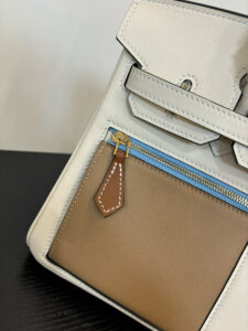 Swift Colormatic Uni Birkin. Authentic quality luxury bag crafted in genuine leather comes with authenticity card, dust bag and gift bag. Where Color Meets Craft — The Art of Birkin Reimagined. The Swift Colormatic Uni Birkin is a rare masterpiece of craftsmanship and color harmony. Expertly handcrafted from luxuriously soft Swift leather, this special-order Birkin reimagines classic sophistication with a playful, modern twist. Its thoughtful design includes a front zipper pocket, rear flat pocket, and the iconic short crossover flap secured by a signature turn-lock closure. Inside, a supple leather interior with both zipper and patch pockets ensures your essentials are beautifully organized. From its smooth texture to its meticulous detailing, the Swift Colormatic Uni Birkin is more than a handbag — it’s an exclusive statement of individuality and timeless *rmès artistry.