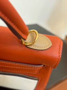 Kelly Colormatic. Authentic quality luxury bag crafted in genuine leather comes with authenticity card, dust bag and gift bag. Where Classic Kelly Meets Colourful Genius. Hand-crafted from ultra-smooth Swift leather and finished with radiant gold hardware, this exceptional limited-edition masterpiece brings a fresh, artistic twist to the iconic Kelly silhouette. Its cleverly designed front pocket opens wide with a single gusset for effortless access, while the rear flap pocket keeps your daily essentials—especially your most-used cards—right at your fingertips. The asymmetric yet perfectly balanced colour combination highlights the haute craftsmanship *rmès is celebrated for, turning every stitch into a statement. A collector’s dream and a style enthusiast’s delight, the Kelly Colormatic is sophistication with a spark—functional, vibrant, and unmistakably *rmès.