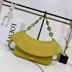 Medium Ola Bag. Authentic quality luxury bag crafted in genuine leather comes with authenticity card, dust bag and gift bag. Soft Curves, Bold Style. Introducing the *OEWE Ola Bag — Where Fluid Design Meets Effortless Luxury. This Ola bag is your new summer essential: soft, lightweight, and irresistibly modern. Defined by its beautifully curved silhouette, flowing flap, and iconic donut chain detail, this piece blends sculptural elegance with everyday practicality. Crafted in smooth, premium calfskin, the medium Ola offers a refined touch while remaining exceptionally versatile. Whether worn for daytime ease or evening polish, it elevates any look with its understated yet striking aesthetic. A statement of craftsmanship. A celebration of movement. A summer icon in the making.