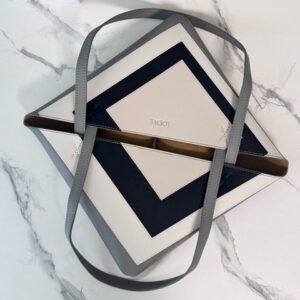 Medium Puzzle Fold Tote.  Authentic quality luxury bag crafted in genuine leather comes with authenticity card, dust bag and gift bag. Modern art meets effortless luxury. This exceptional piece reimagines the iconic Puzzle Fold silhouette with a lightweight geometric structure that folds completely flat, making it the ultimate travel companion. Crafted in supple nappa calfskin, the tote features exquisite leather marquetry squares inspired by Josef Albers’s celebrated Homage to the Square series. Each panel reflects precision, balance, and *OEWE’s unmatched craftsmanship, transforming a functional tote into a wearable work of art. Part of the exclusive *OEWE x Albers collection, this medium Puzzle Fold tote blends practicality with cultural sophistication, offering spacious elegance for everyday moments, weekend escapes, and artful adventures. A collectible masterpiece—crafted for the modern collector.