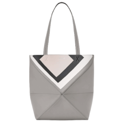 Medium Puzzle Fold Tote.  Authentic quality luxury bag crafted in genuine leather comes with authenticity card, dust bag and gift bag. Modern art meets effortless luxury. This exceptional piece reimagines the iconic Puzzle Fold silhouette with a lightweight geometric structure that folds completely flat, making it the ultimate travel companion. Crafted in supple nappa calfskin, the tote features exquisite leather marquetry squares inspired by Josef Albers’s celebrated Homage to the Square series. Each panel reflects precision, balance, and *OEWE’s unmatched craftsmanship, transforming a functional tote into a wearable work of art. Part of the exclusive *OEWE x Albers collection, this medium Puzzle Fold tote blends practicality with cultural sophistication, offering spacious elegance for everyday moments, weekend escapes, and artful adventures. A collectible masterpiece—crafted for the modern collector.