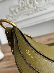 Banana Cross-Body Bag.  Authentic quality luxury bag crafted in genuine leather comes with authenticity card, dust bag and gift bag. Playful Design, Iconic Craftsmanship Meet your new style statement: the *LOÉ Banana, a charming cross-body bag crafted from luxurious shiny grained calfskin. Inspired by *loé’s legendary Spring 2001 collection, its sculptural, banana-shaped silhouette highlights the Maison’s signature artistry with a refined 3D textured effect. Perfectly sized to hold your phone, cardholder, and daily essentials, this lighthearted yet sophisticated accessory blends practicality with Parisian elegance. An adjustable strap allows effortless shoulder or crossbody wear, making it your go-anywhere companion.