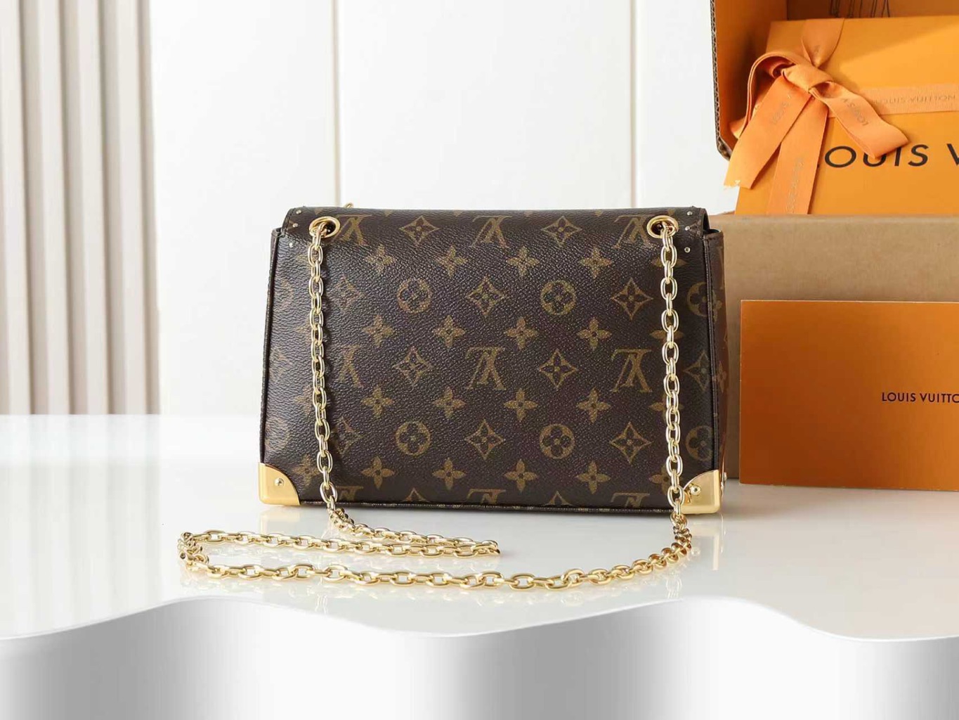 Trunkie 5 Trunkie. Authentic quality luxury bag crafted in genuine leather comes with authenticity card, dust bag and gift bag. Heritage, Reimagined for Today. A bold tribute to the House’s storied past, the Trunkie brings the spirit of vintage travel into a sleek, modern silhouette. Crafted in iconic Monogram canvas and adorned with 38 gold-toned rivets, it echoes the timeless charm of classic LV trunks. Metallic corners and the signature S-lock closure elevate its structured design, while the sliding chain offers versatile styling—from shoulder to crossbody with effortless ease. Inside, a thoughtfully sized interior with a zipped pocket keeps your essentials perfectly organized. Where history meets modern sophistication, the Trunkie is more than a bag—it’s a statement of enduring luxury.