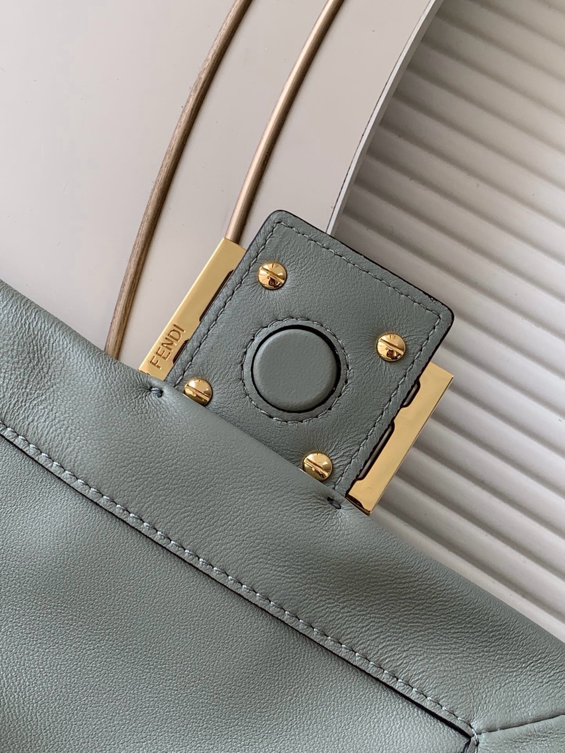 Mamma Baguette Small 5 Small Mamma Baguette. Authentic quality luxury bag crafted in genuine leather comes with authenticity card, dust bag and gift bag. A Soft Revival of an Icon. Born in the late ’90s as the effortlessly chic “big sister” to the original, the Mamma Baguette returns for Spring/Summer 2025 with a modern, deconstructed allure. Reimagined in dreamy nappa leather, it blends nostalgia with a fresh, fluid silhouette that feels both relaxed and refined. An oversized FF clasp, accented with a tonal leather insert, anchors the design with signature *ENDI attitude. Inside, a generously sized suede-lined compartment with a drawstring closure and ties offers both luxury and practicality. Finished with gold-tone hardware and complete with detachable handle and shoulder strap, it transitions seamlessly from hand-held elegance to crossbody ease. Soft, iconic, and undeniably modern—the Mamma Baguette is back, and better than ever.
