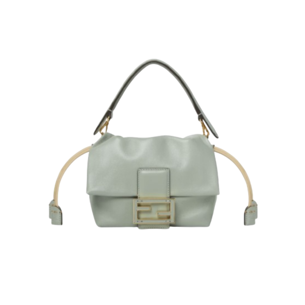 Mamma Baguette Small 1 Small Mamma Baguette. Authentic quality luxury bag crafted in genuine leather comes with authenticity card, dust bag and gift bag. A Soft Revival of an Icon. Born in the late ’90s as the effortlessly chic “big sister” to the original, the Mamma Baguette returns for Spring/Summer 2025 with a modern, deconstructed allure. Reimagined in dreamy nappa leather, it blends nostalgia with a fresh, fluid silhouette that feels both relaxed and refined. An oversized FF clasp, accented with a tonal leather insert, anchors the design with signature *ENDI attitude. Inside, a generously sized suede-lined compartment with a drawstring closure and ties offers both luxury and practicality. Finished with gold-tone hardware and complete with detachable handle and shoulder strap, it transitions seamlessly from hand-held elegance to crossbody ease. Soft, iconic, and undeniably modern—the Mamma Baguette is back, and better than ever.