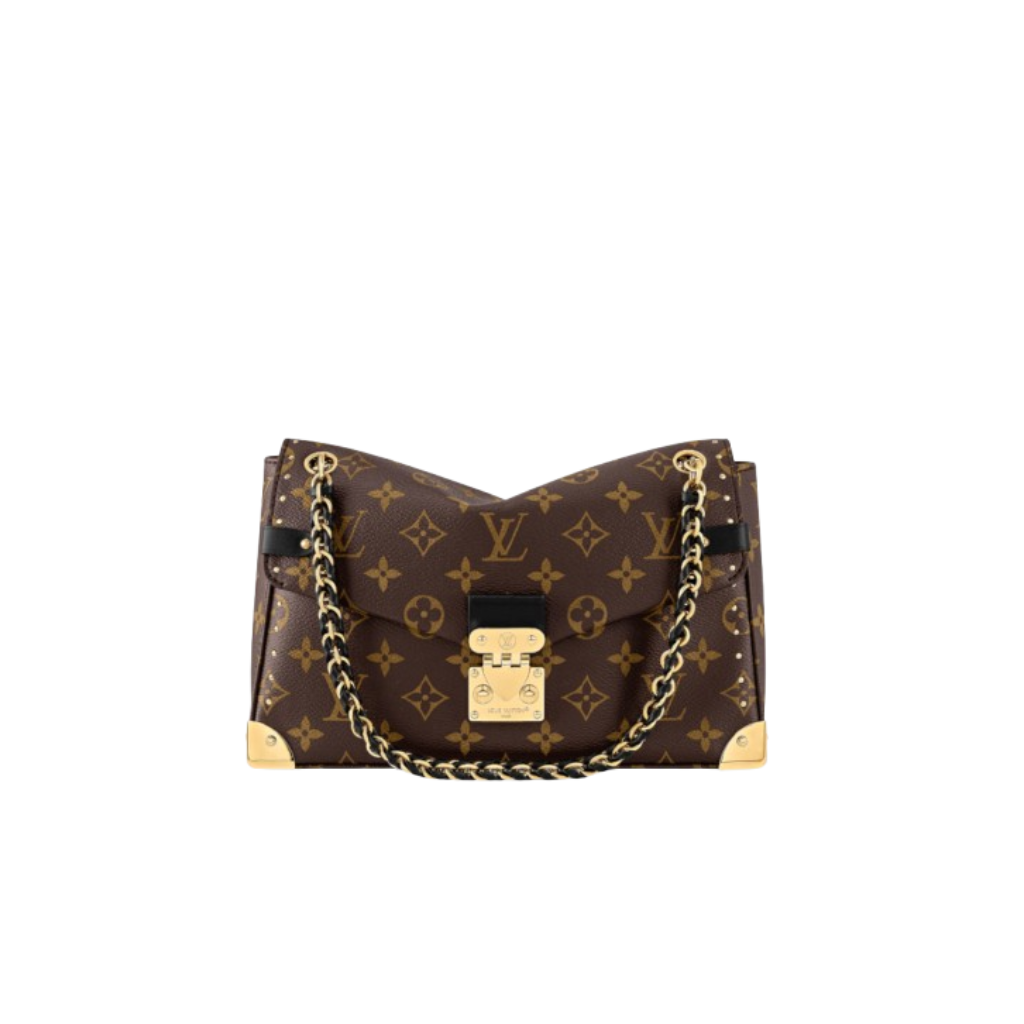 Trunkie 1 Trunkie. Authentic quality luxury bag crafted in genuine leather comes with authenticity card, dust bag and gift bag. Heritage, Reimagined for Today. A bold tribute to the House’s storied past, the Trunkie brings the spirit of vintage travel into a sleek, modern silhouette. Crafted in iconic Monogram canvas and adorned with 38 gold-toned rivets, it echoes the timeless charm of classic LV trunks. Metallic corners and the signature S-lock closure elevate its structured design, while the sliding chain offers versatile styling—from shoulder to crossbody with effortless ease. Inside, a thoughtfully sized interior with a zipped pocket keeps your essentials perfectly organized. Where history meets modern sophistication, the Trunkie is more than a bag—it’s a statement of enduring luxury.